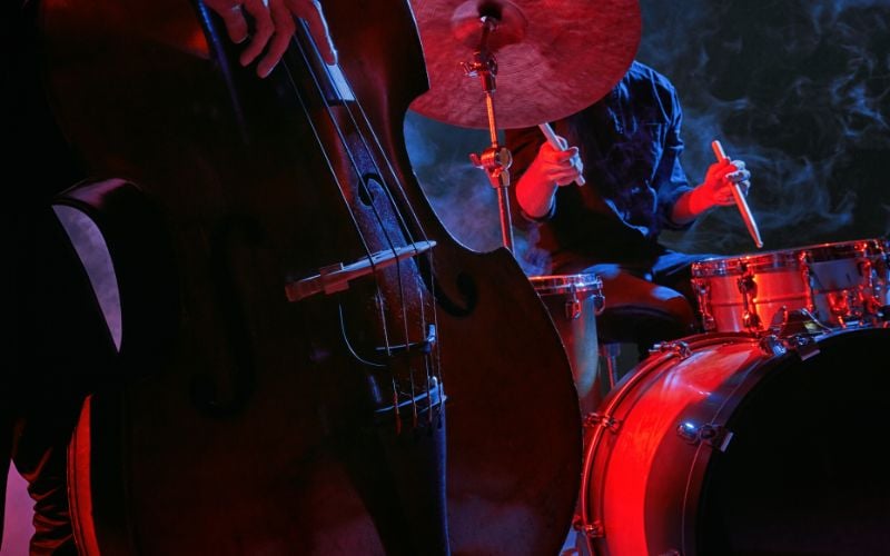 Up close shot of jazz instruments with red stage lighting