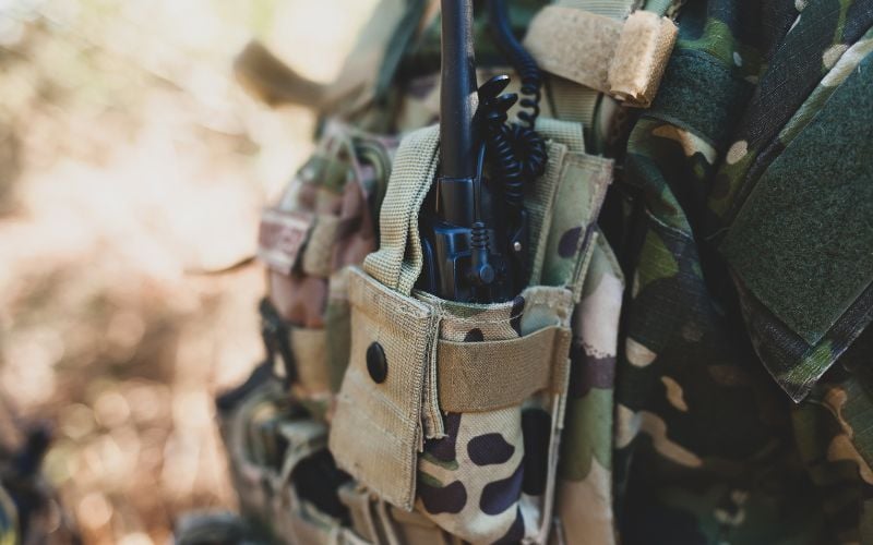 Up close shot of pocket radio attached to military gear